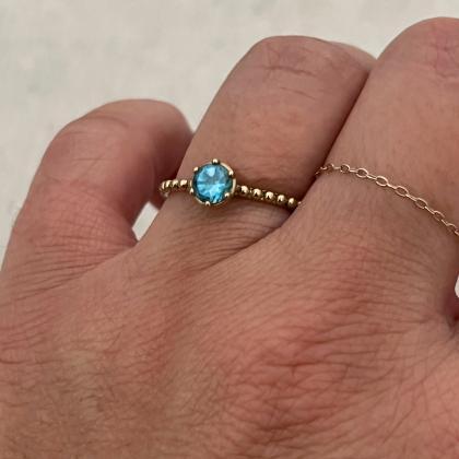 Engagement blue topaz ring, solitai..