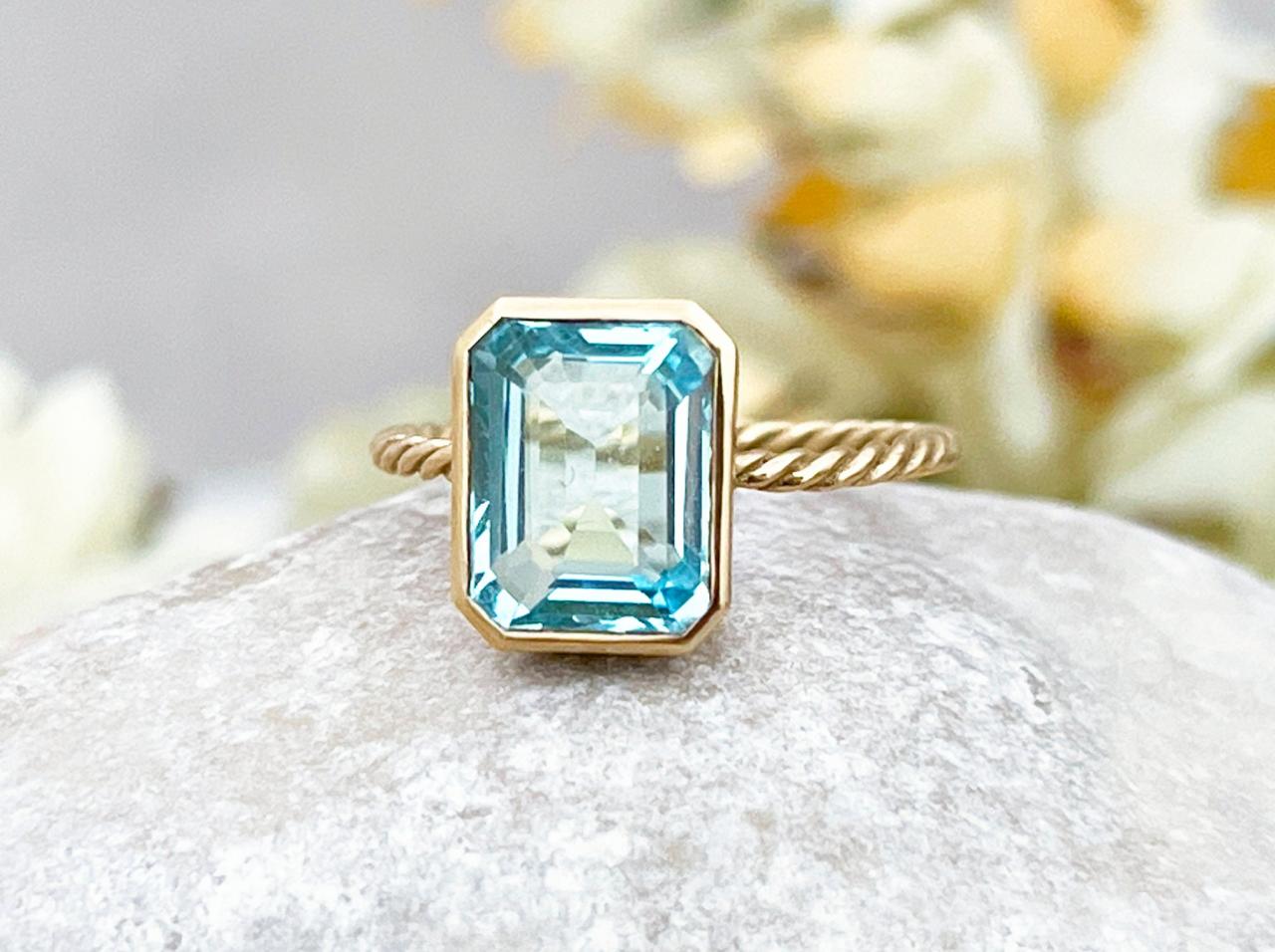 Blue topaz solid gold solitaire engagement ring, Natural emerald cut light blue stone proposal ring, 18k modern style twist ring
