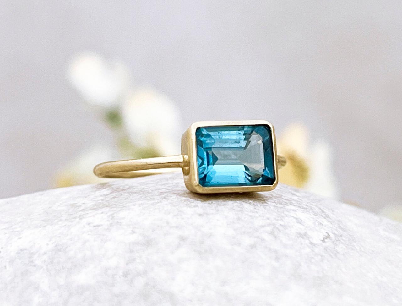 Gold engagement ring with emerald cut London blue topaz, Solitaire natural blue gemstone wedding ring, 18k dainty bezel set ring